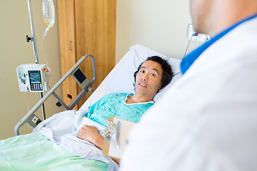 Image showing Patient Looking At Doctor While Lying On Bed In Hospital