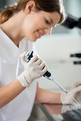 Image showing Technician Using Pipette In Laboratory