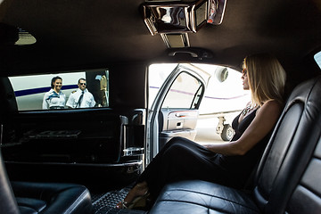 Image showing Elegant Woman In Limousine At Airport Terminal