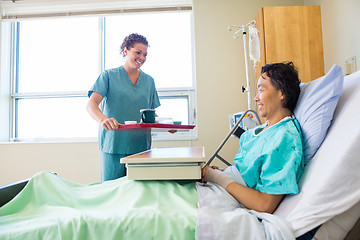 Image showing Nurse Bringing Breakfast For Patient In Hospital