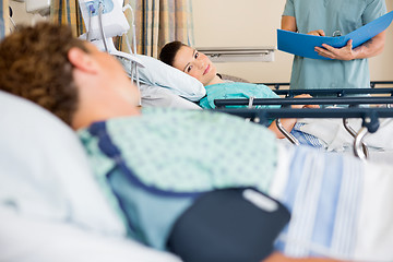 Image showing Patient's Looking At Each Other In Hospital Ward