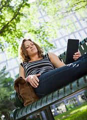 Image showing University Student Using Digital Tablet On Bench