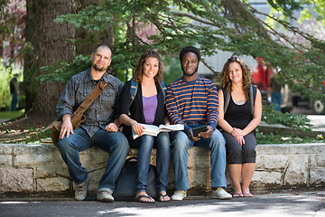 Image showing Portrait Of University Students Sitting On Campus