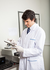 Image showing Researcher Using Digital Tablet In Medical Lab