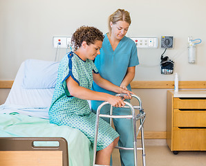 Image showing Patient With Walker While Nurse Assisting Her In Hospital