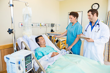 Image showing Patient Looking At Medical Team In Hospital Room