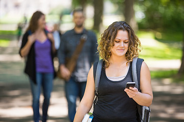 Image showing Female Student Using Cellphone On Campus