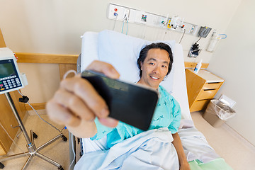 Image showing Patient Taking Self Portrait Through Cell Phone In Hospital