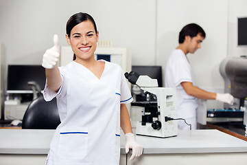 Image showing Scientist Gesturing Thumbs Up In Laboratory