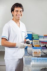 Image showing Man Scanning Medical Sample In Laboratory