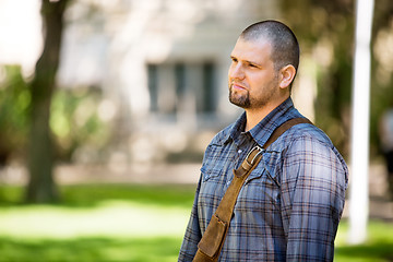 Image showing Thoughtful Student Standing At Campus