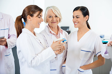 Image showing Researcher With Colleagues Discussing Over Medicines