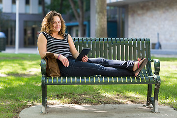 Image showing Female University Student Relaxing On Bench