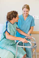 Image showing Nurse Assisting Patient Using Walker In Hospital