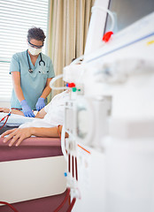 Image showing Nurse Giving Renal Dialysis Treatment To Patient