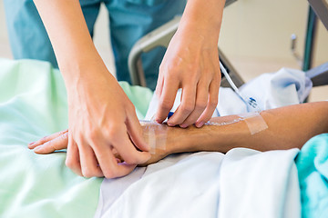 Image showing Nurse Starting an IV Line