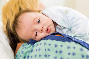 Image showing Cute Babygirl Resting On Mother's Shoulder In Hospital