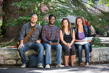 Image showing University Students Sitting On Parapet At Campus