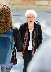 Image showing College Professor Walking to Class Outdoors
