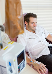 Image showing IV Drip Attached To Patient's Hand