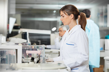 Image showing Mecial Research Tech Using Centrifuge