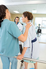 Image showing Physical Therapist Assisting Female Patient In Walking