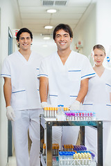 Image showing Technicians With Medical Cart In Hospital Corridor