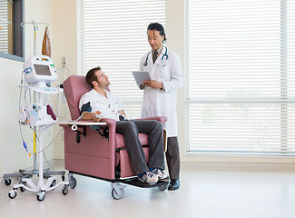 Image showing Patient Looking At Doctor Using Digital Tablet In Chemo Room