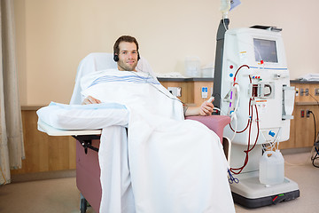 Image showing Patient Listening To Music While Receiving Renal Dialysis