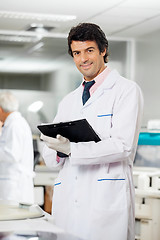 Image showing Technician With Clipboard In Laboratory