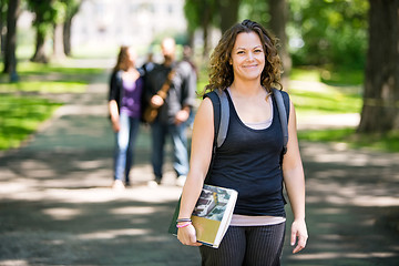 Image showing Smiling Student Standing On Campus Road