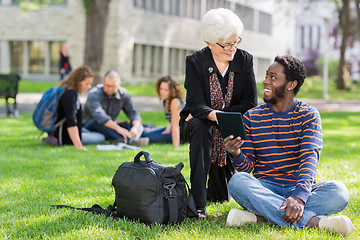 Image showing Professor and Student Working Together Outdoors