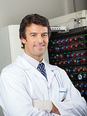 Image showing Microbiologist Standing By Blood Culture Instrument