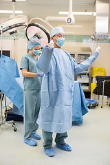 Image showing Nurse Assisting Surgeon With Sterile Gown