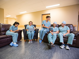 Image showing Medical Team Using Technologies In Hospital's Waiting Room