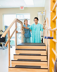 Image showing Male Patient Being Assisted By Physical Therapist