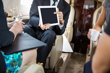 Image showing Business Partners Working In Private Jet