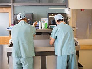 Image showing Surgeons Scrubbing Hands