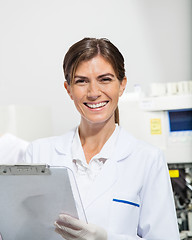 Image showing Scientist Holding Clipboard In Laboratory