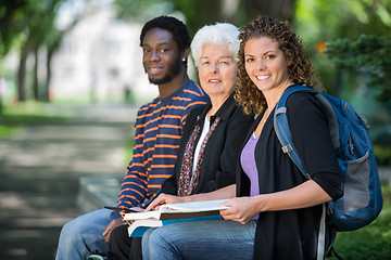 Image showing Confident University Students Sitting On Campus