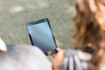 Image showing University Students Holding Digital Tablets