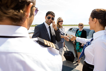 Image showing Corporate People Greeting Pilot And Airhostess At Airport