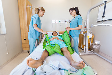 Image showing Nurses Preparing Male Patient Before Transferring Him On Hydraul