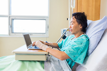 Image showing Patient Using Laptop On Bed In Hospital