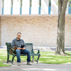 Image showing University Student Using Digital Tablet On Bench