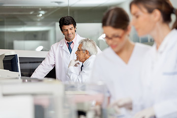 Image showing Male Technicians Discussing In Lab