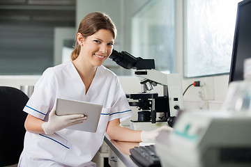 Image showing Female Scientist Holding Digital Tablet In Lab