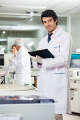 Image showing Scientist With Clipboard In Laboratory