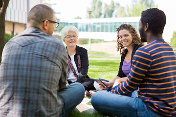 Image showing University Professor Helping Students Outdoors