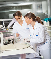 Image showing Researchers Operating Machine In Lab